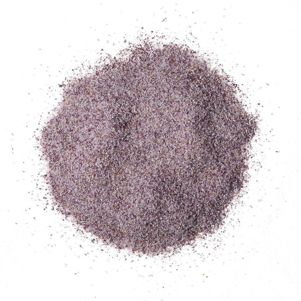 Purple sand-like material on a white background