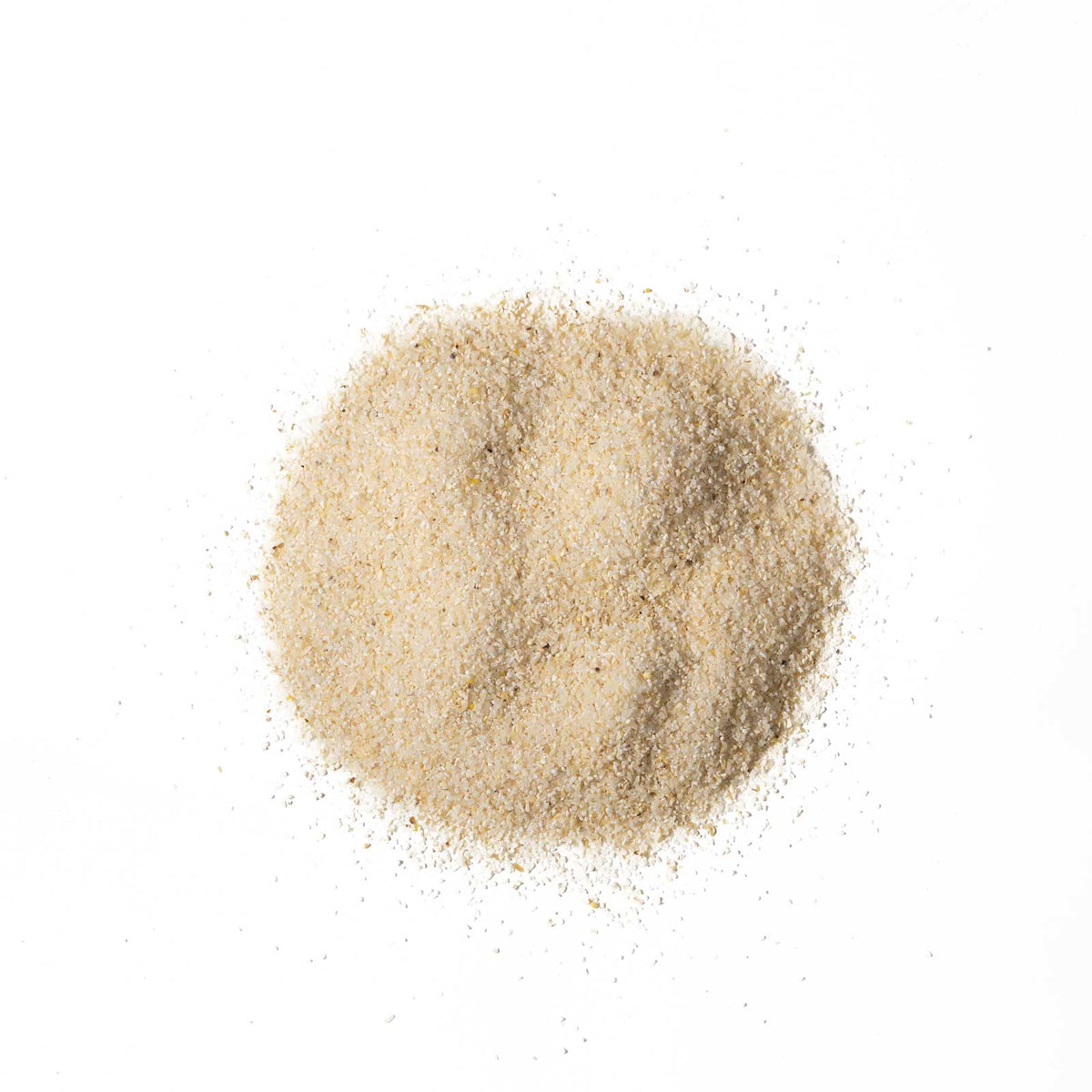 Beige sand-like powder on a white background