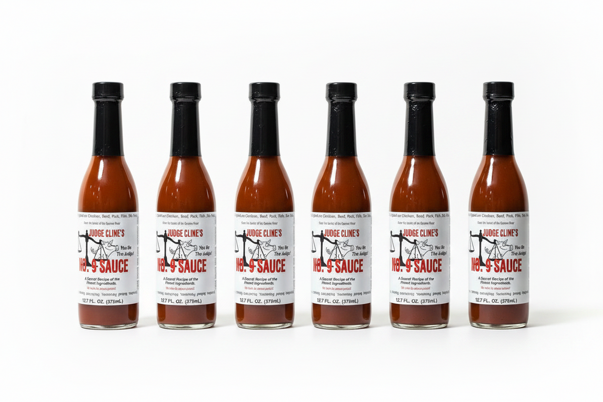 6-Pack of Judge Cline's No. 9 Sauce lined up.