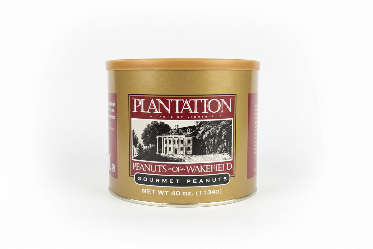 A 40 oz metal tin of Plantation Peanuts of Wakefield Gourmet Peanuts, featuring a gold-colored body, a matching gold lid, and a label with a white and burgundy design showing a plantation house.
